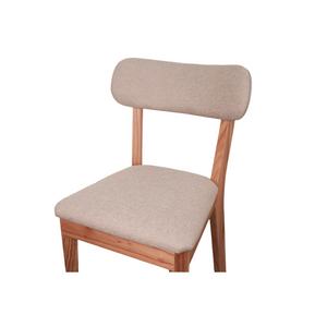 Kea solid wood dining chair with fabric-upholstered seat and curved fabric backrest – front view showing full chair structure in walnut finish